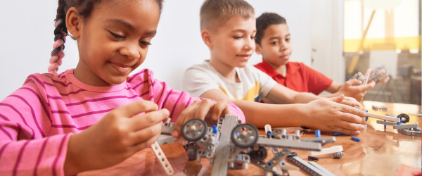 young kids building a robot