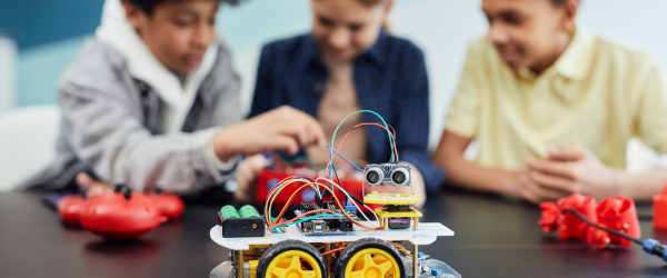 young kids building a robot