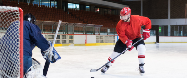 adults playing hockey