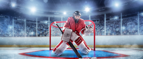 hockey players with a puck skating