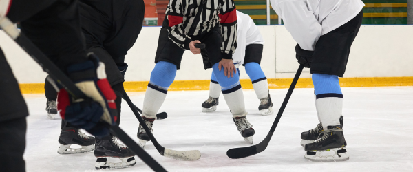 adults playing hockey