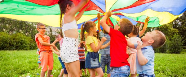 summer camp kids playing outside in the sun