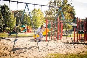 child on swing at Laviolette park