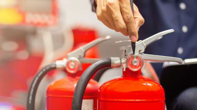 fire extingushers with a hand